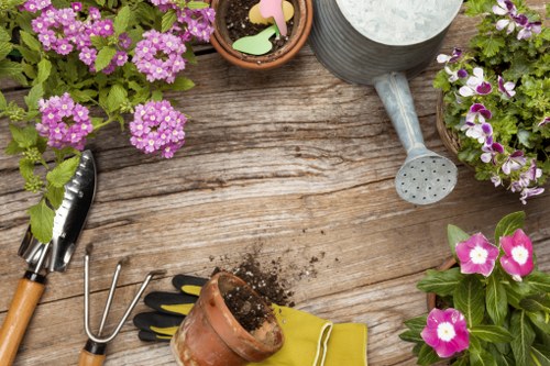 Gardeners Harmondsworth working safely with insured garden tools