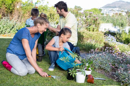 Professional gardener managing a safe work area during maintenance